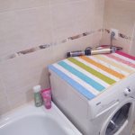 How to stylishly cover a washing machine in the bathroom